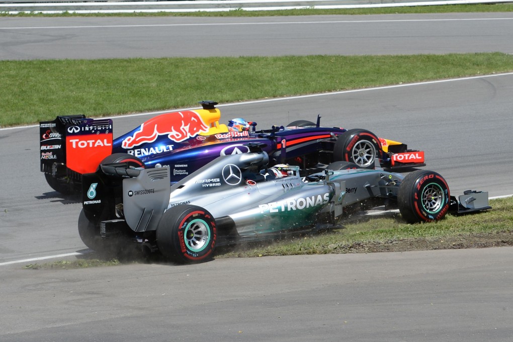 Lewis Hamilton (bottom, in the Mercedes, alongside Sebastian Vettel in the Red Bull) was forced off at the first turn and retired from the race in Montreal earlier this month. Photo: AFP