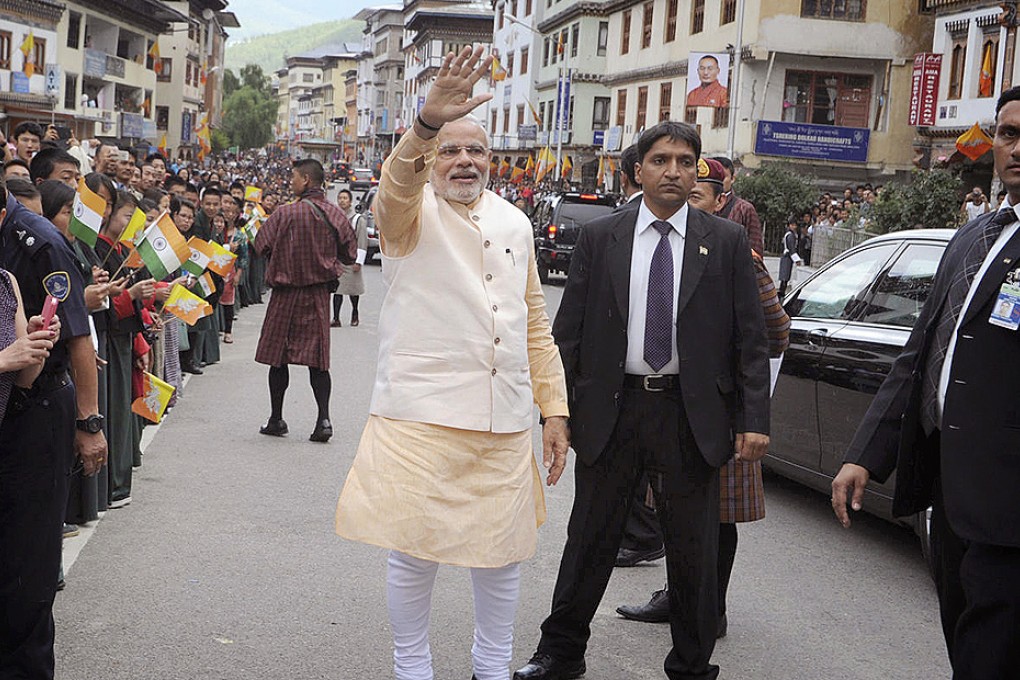 Narendra Modi takes to the street in Bhutan. Photo: Reuters