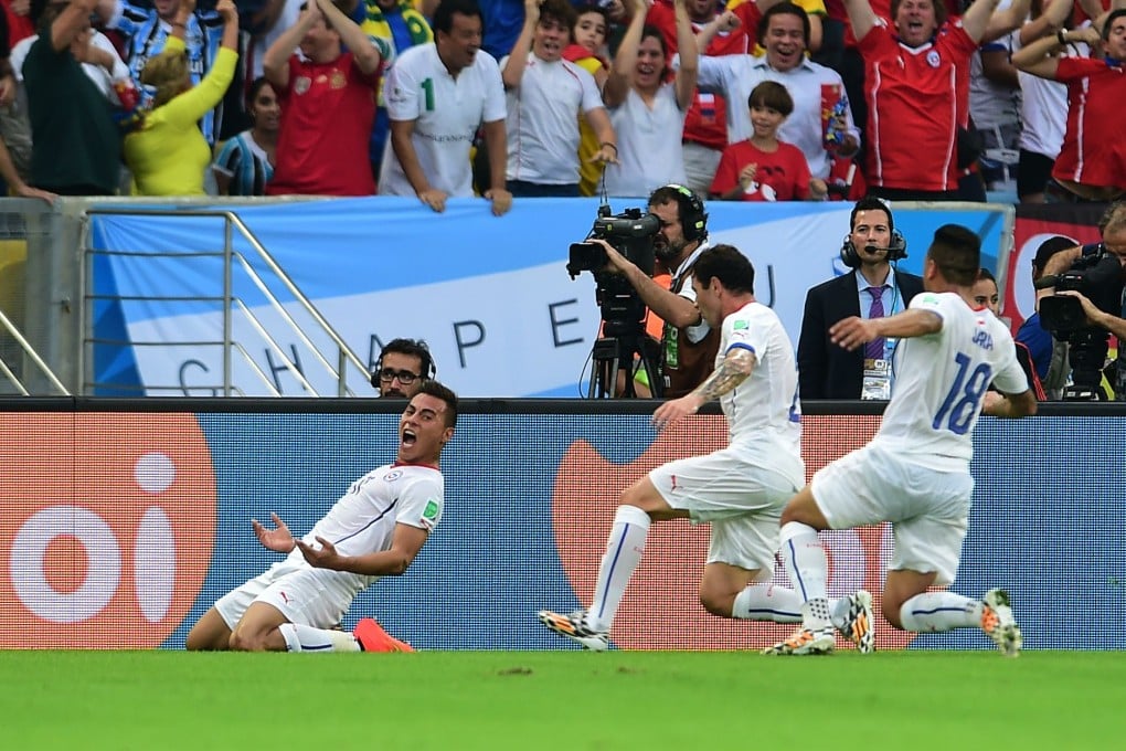Eduardo Vargas celebrates his goal. Photo: AFP