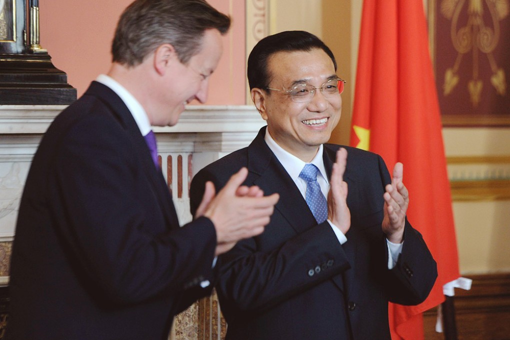 David Cameron and Li Keqiang share a joke during a signing ceremony in London on Tuesday. Photo: Xinhua