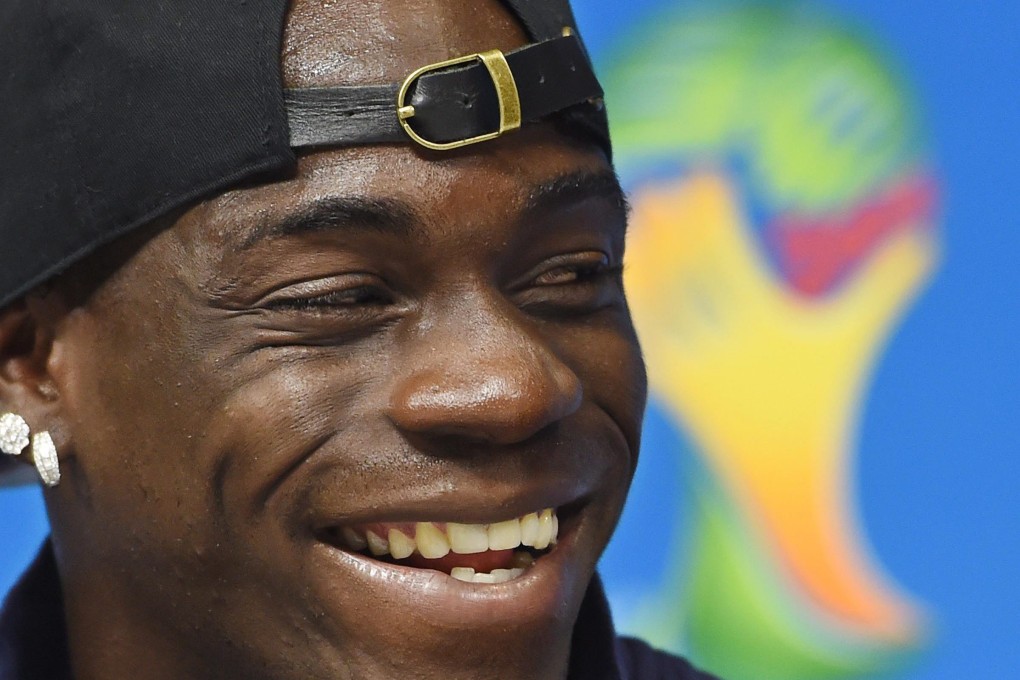Mario Balotelli is enjoying himself a lot more than England's players at this World Cup. Photo: AP