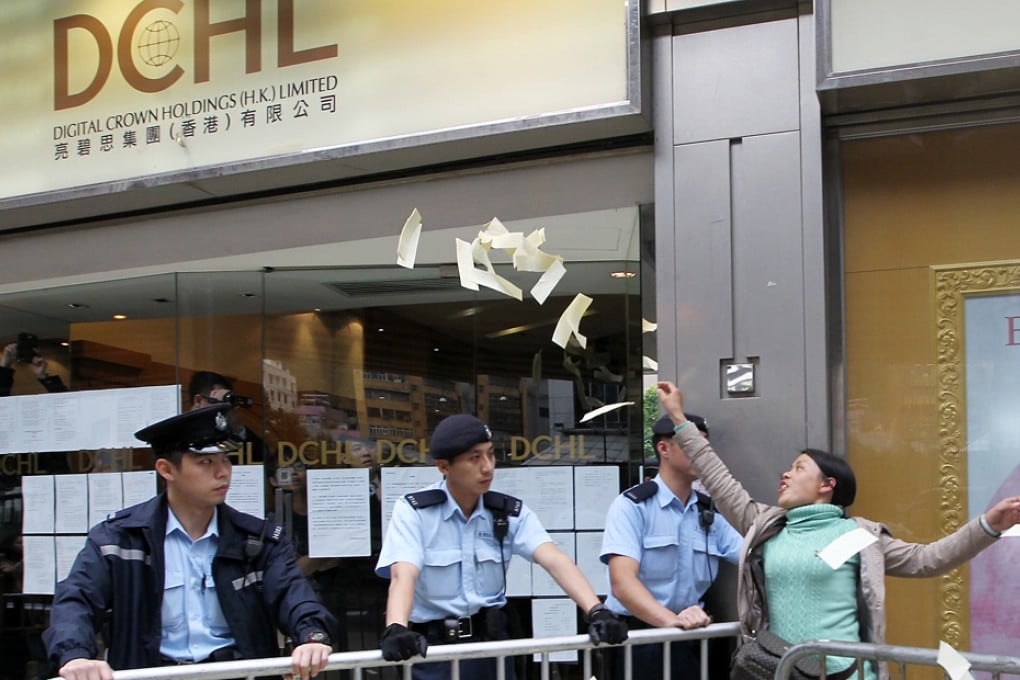 Protesters throw hell money outside DCHL office in Causeway Bay. Photo: Sam Tsang