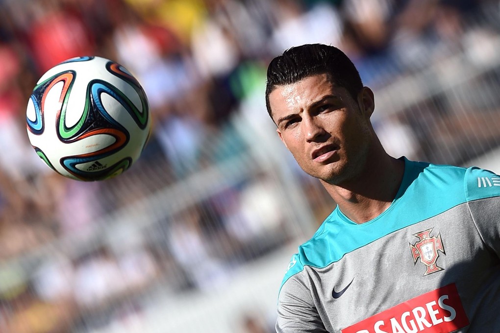 Portugal's world player of the year Cristiano Ronaldo eyes the ball during a training session in Sao Paulo. There is much speculation over whether or not he will play against the United States. Photo: AFP