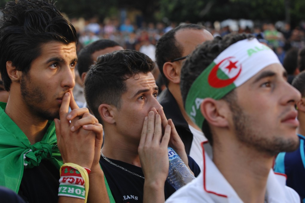 Algeria fans look stony-faced during their team's 2-1 loss to Belgium. Photo: AP