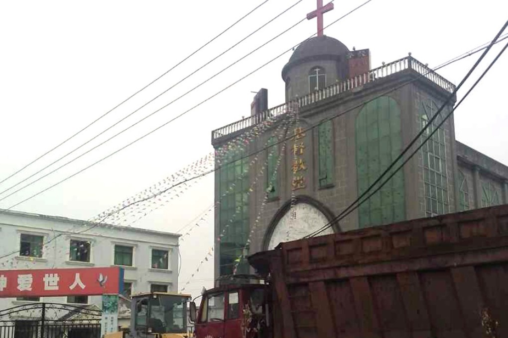 Heavy trucks sent by Christians block the gates of the Chuiyang Church in Wenzhou. Photo: SCMP Pictures