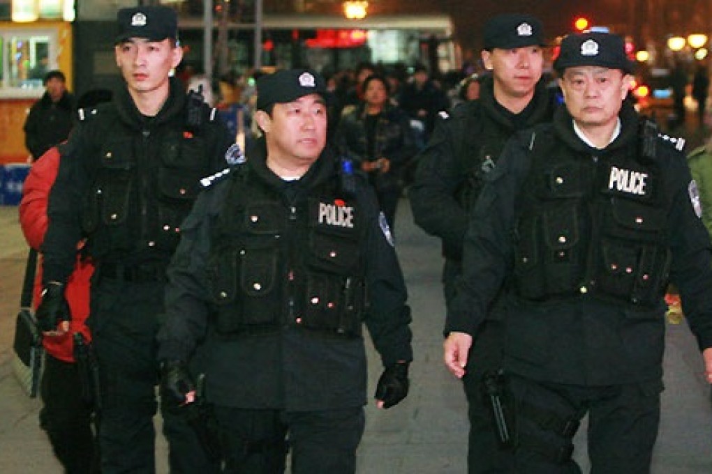 A photo of Fu Zhenghua, second from left, patrolling Wangfujing shopping street. Photo: Sina Weibo
