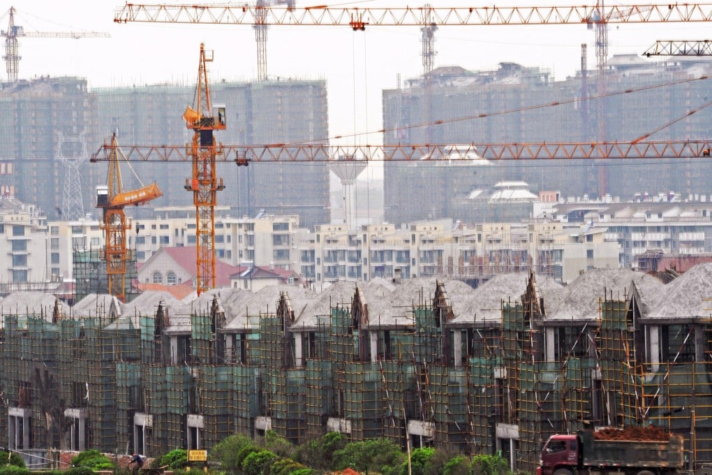 Faced with a glut, most developers are offering incentives to boost home sales in Hangzhou, while others are cutting prices. Photo: Xinhua