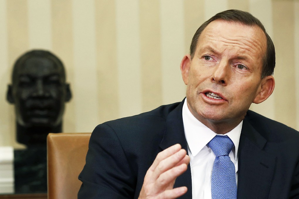 Australian Prime Minister Tony Abbott will have to negotiate with the mining magnate to pass the laws. Photo: Reuters