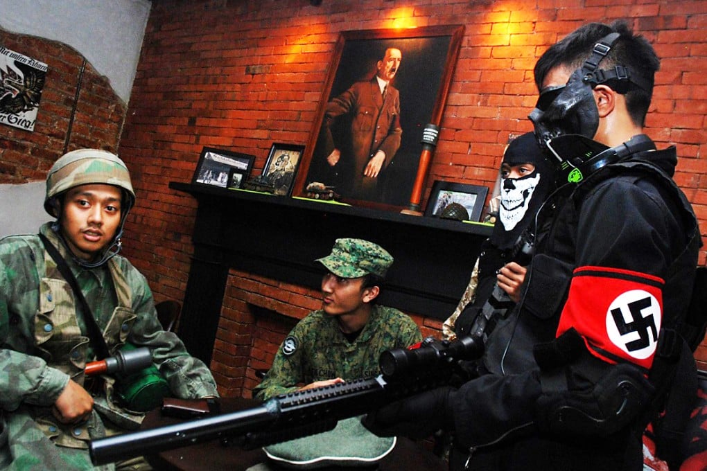 Customers in military uniforms at the reopened cafe. Photo: AFP