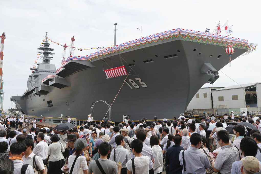 Japanese warship "Izumo", which has a flight deck that is nearly 250 metres long, is unveiled in Yokohama, south of Tokyo, Tuesday, Aug. 6, 2013. Photo: AP