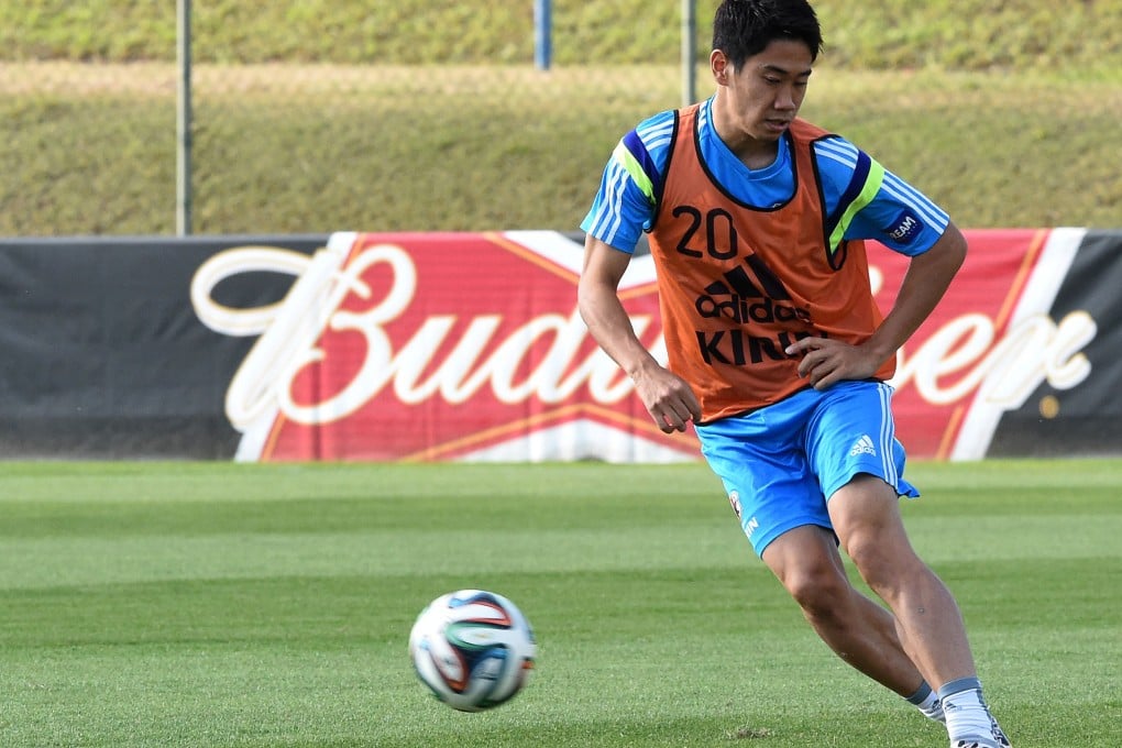 Japan's forward Shinji Kagawa kicks the ball during a training session at their Itu camp in Sao Paulo. Photo: AFP