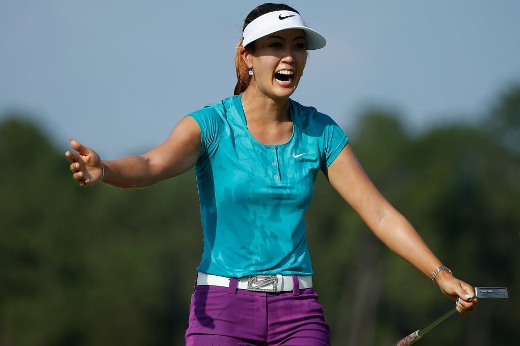 Michelle Wie celebrates on the 18th green after her two-stroke victory at the 69th US Women's Open at Pinehurst, North Carolina. Photo: AFP