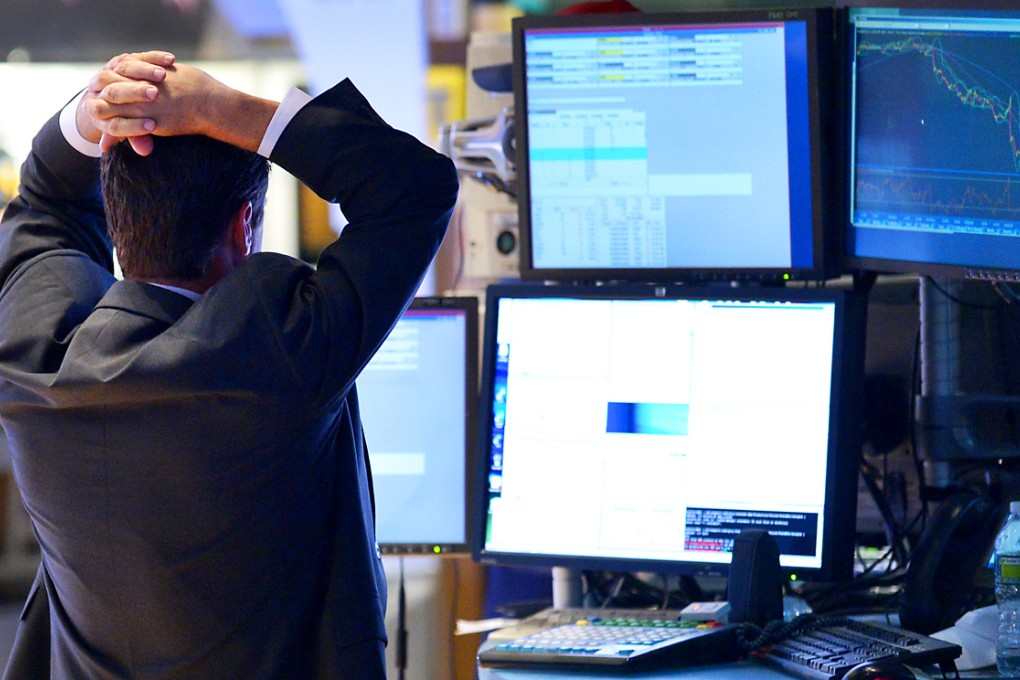 A trader works on the floor of the New York Stock Exchange in New York. Photo: EPA