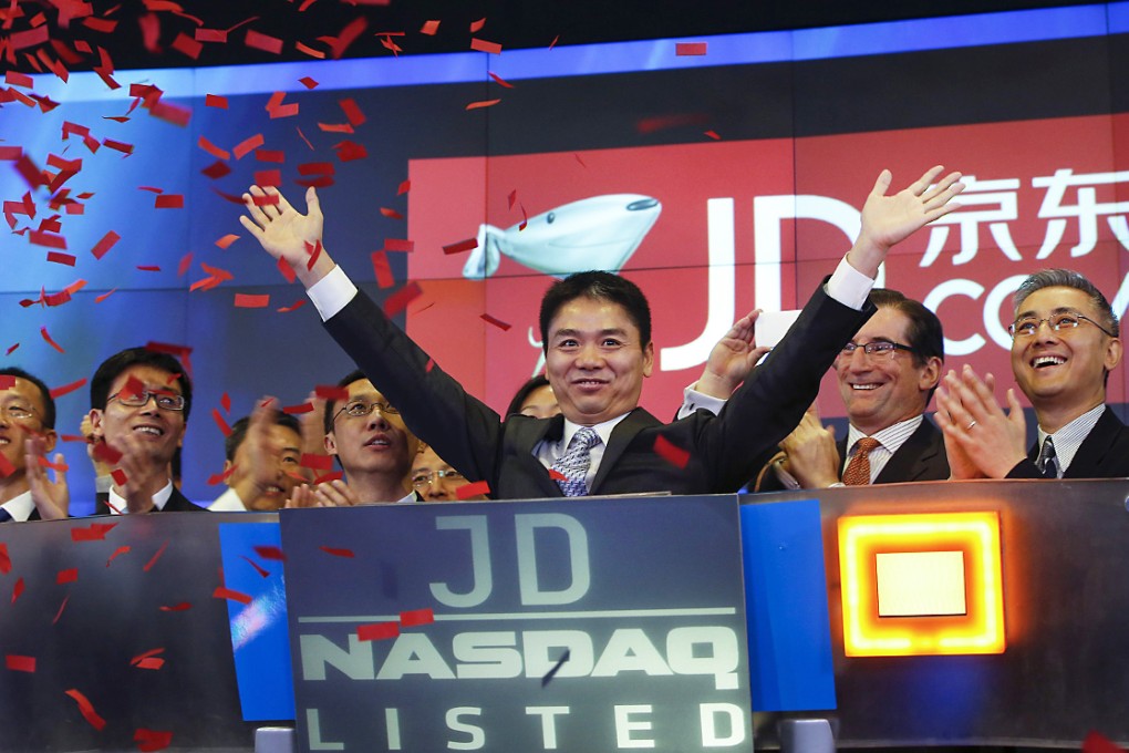 Richard Liu, CEO and founder of China's e-commerce company JD.com, raises his hands after the opening bell at the NASDAQ Market Site building at Times Square in New York. Photo: Reuters