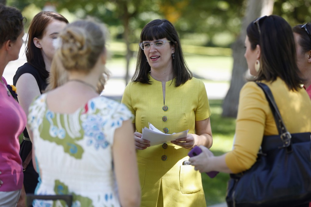 Kate Kelly talks to supporters before a vigil as members of the leadership of Church of Jesus Christ and Latter-day Saints consider her excommunication from the church in Salt Lake City, Utah, June 22, 2014. Photo: Reuters