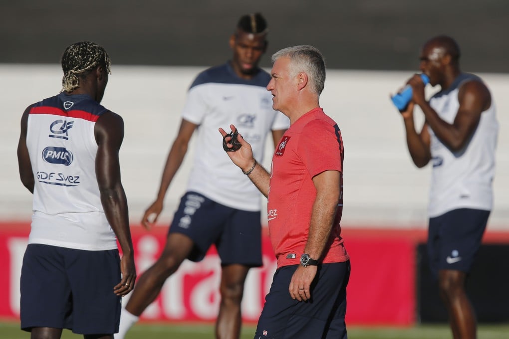 Coach Didier Deschamps talks to his players during training in Ribeirao Preto. France face Ecuador in their last group game. Photo: AP