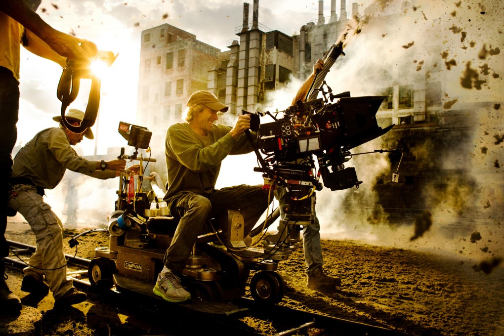 Director Michael Bay is very much hands-on in these scenes from Transformers: Age of Extinction.