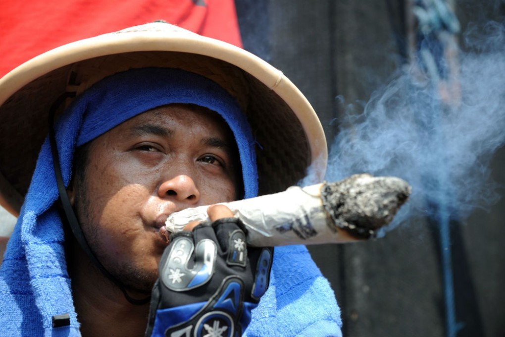 An Indonesian tobacco farmer protests against a new regulation plan for cigarettes in Jakarta in this 2011 file photo. Photo: AFP