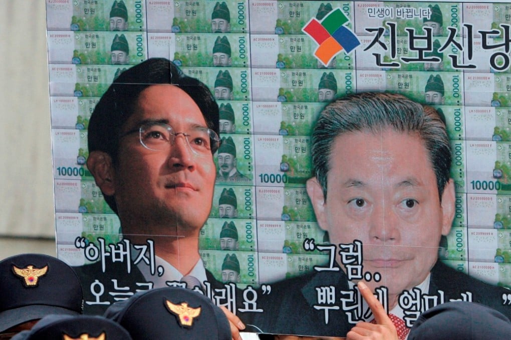 A picture of Samsung Group Chairman Lee Kun-hee, right, and his son Lee Jae-yong. Photo: AP