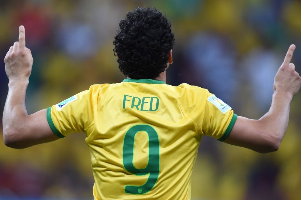Fred celebrates his goal against Cameroon. Photo: AFP