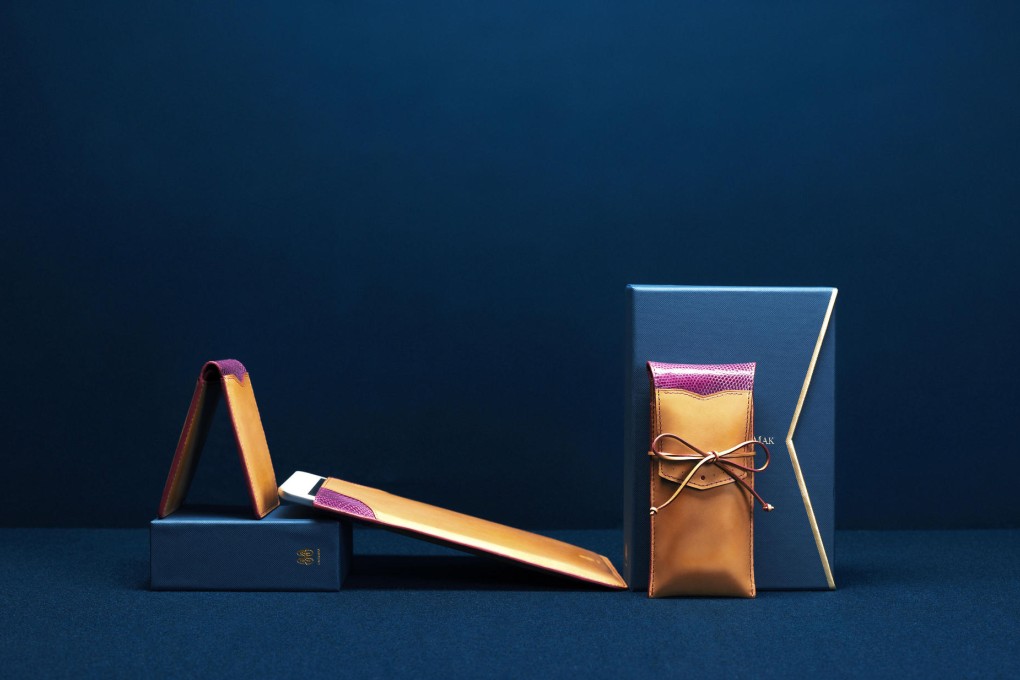 Small leather goods by Bertrand Mak. Mak (above right) says he exercises strong control over the products and is not interested in displays of branding.