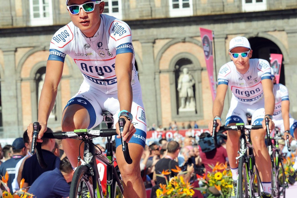 Ji Cheng (left), pictured here at a team presentation in Naples, rode the Giro d'Italia last year. Photo: EPA