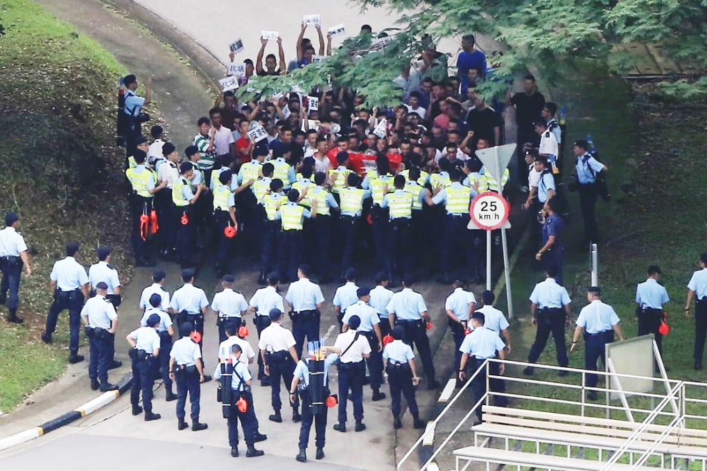 Officers try to control a mock protest at the Police College during an exercise to prepare for Occupy Central. Photo: Felix Wong