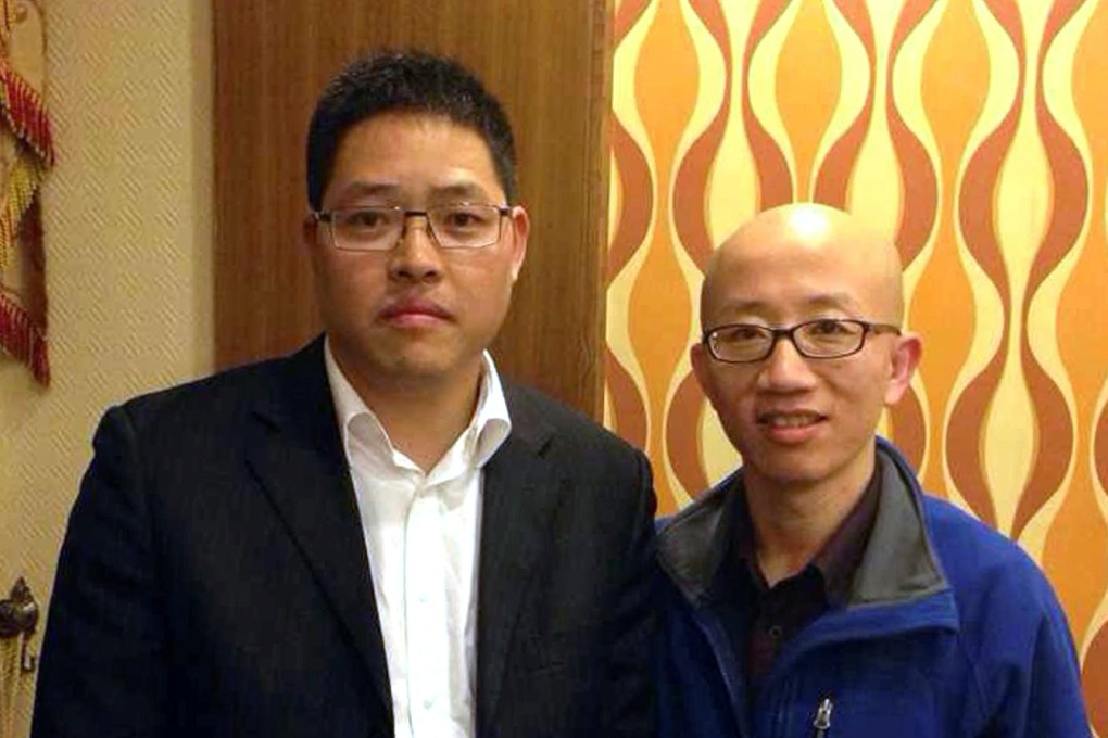 Wang Aizhong (left), founder of the Southern Street Movement against China's one-party rule, poses with a fellow activist, in this photo released by Wang's family. Photo: AP