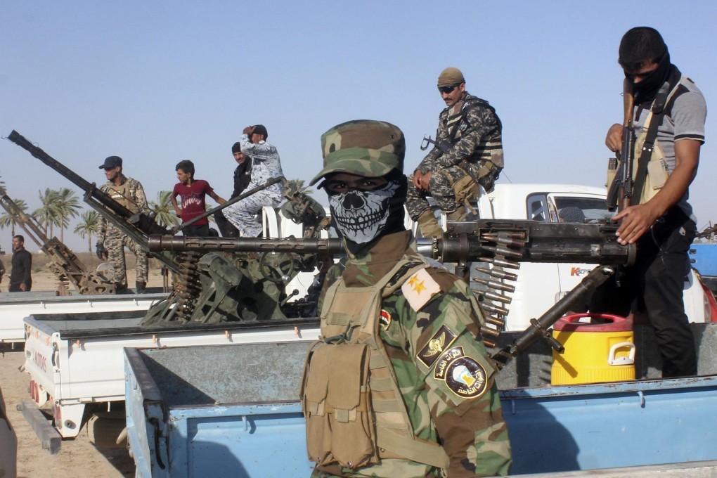 A Shiite volunteer joins the fight against the Islamists. Photo: Reuters