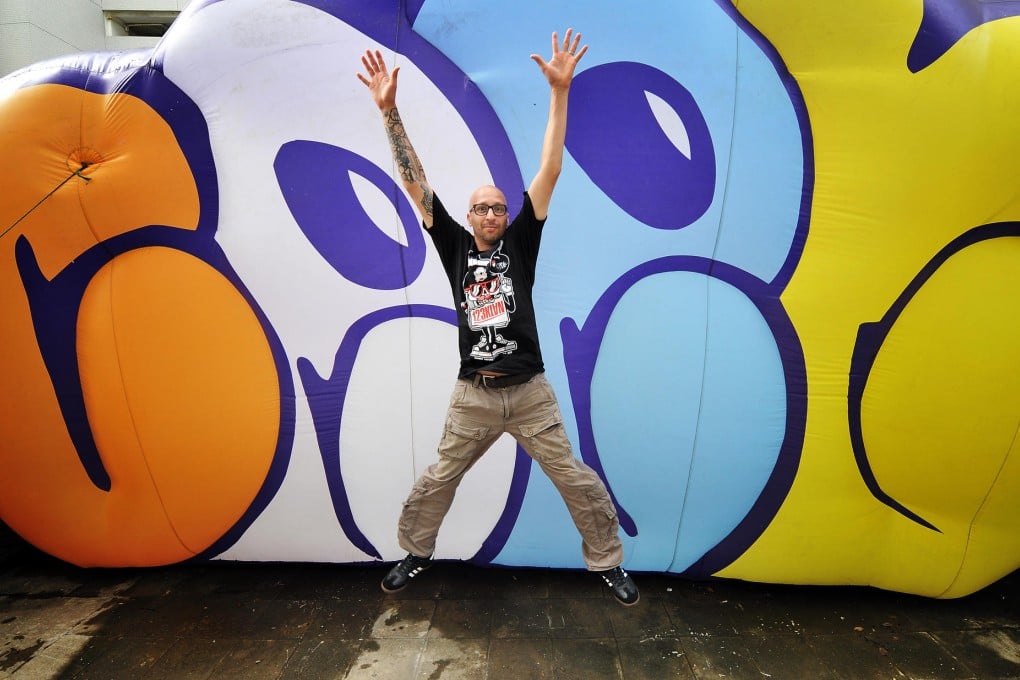 Fouad Ceet makes like a star in front of one of his works at Toof Contemporary gallery in Ap Lei Chau. Photo: Bruce Yan