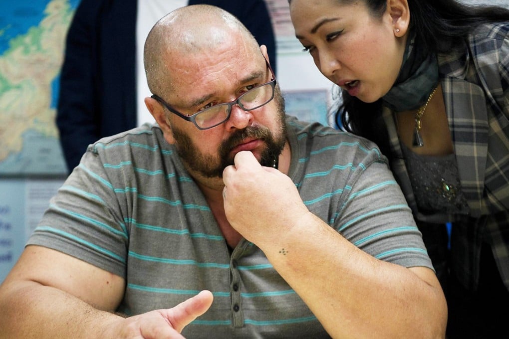 Alexander Matusov listens to his translator in Bangkok. Photo: AFP