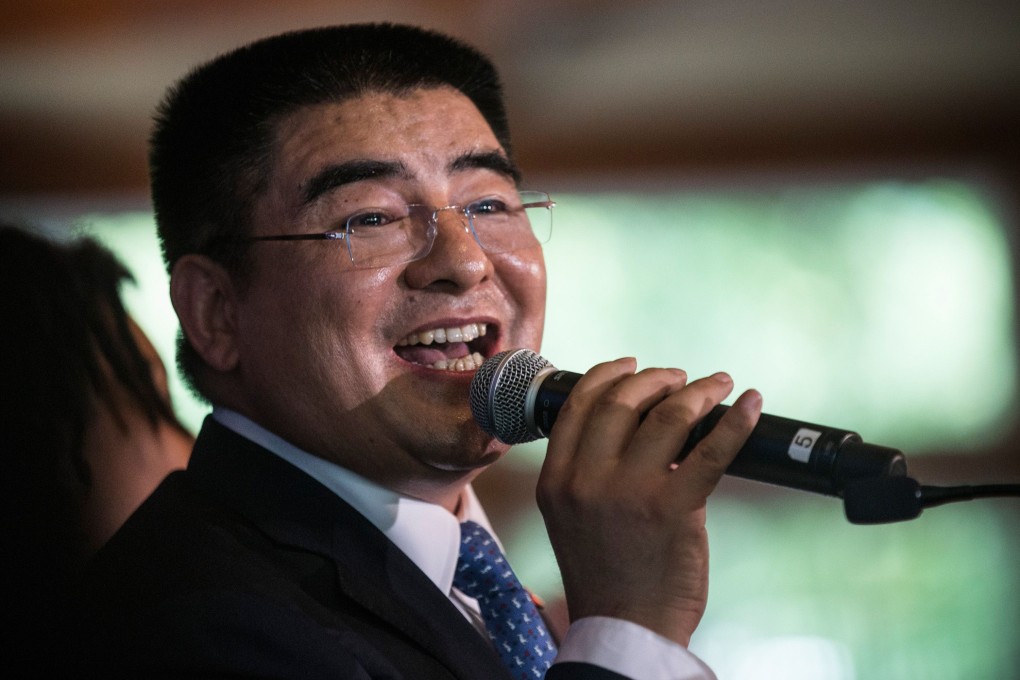 Chen Guangbiao belts out his signature track 'We are the World' at the lunch to entertain guests. Photo: AFP