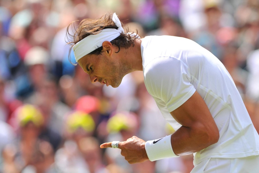 Rafael Nadal celebrates getting a break back in a tense second set against Lukas Rosol at the All England Club. Photo: AFP