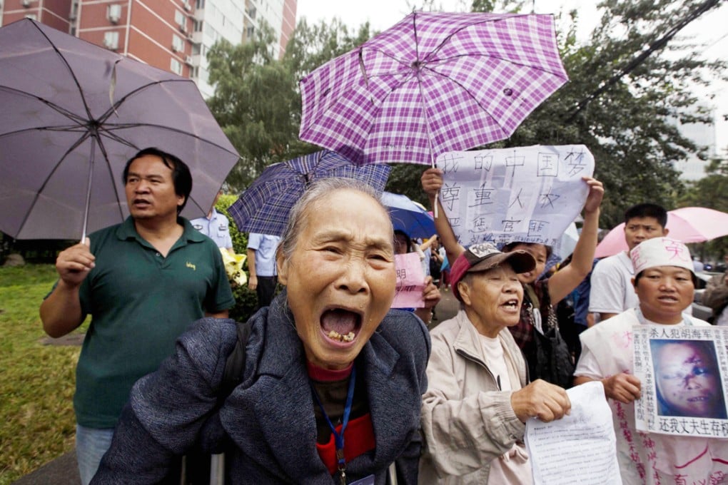 Xu Jie used to head the State Bureau for Letters and Calls, in charge of handling petitioners (above) who often make the risky trek to Beijing to air grievances to higher authorities. Photo: AP