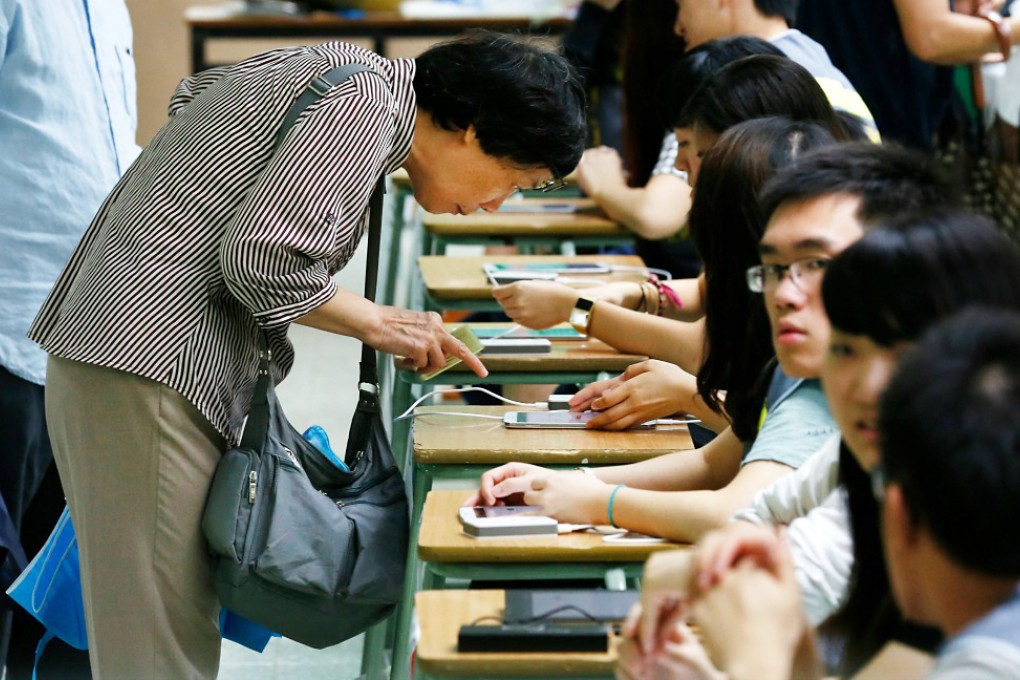 A voter registering before casting her ballot last Sunday in Occupy's poll. New polling stations will be open this Sunday. Photo: AP