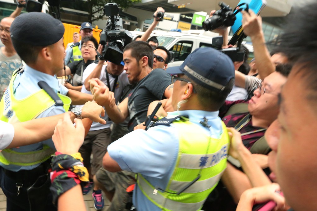 Protesters scuffle with police officers at a protest against new town development in the New Territories. Photo: Felix Wong