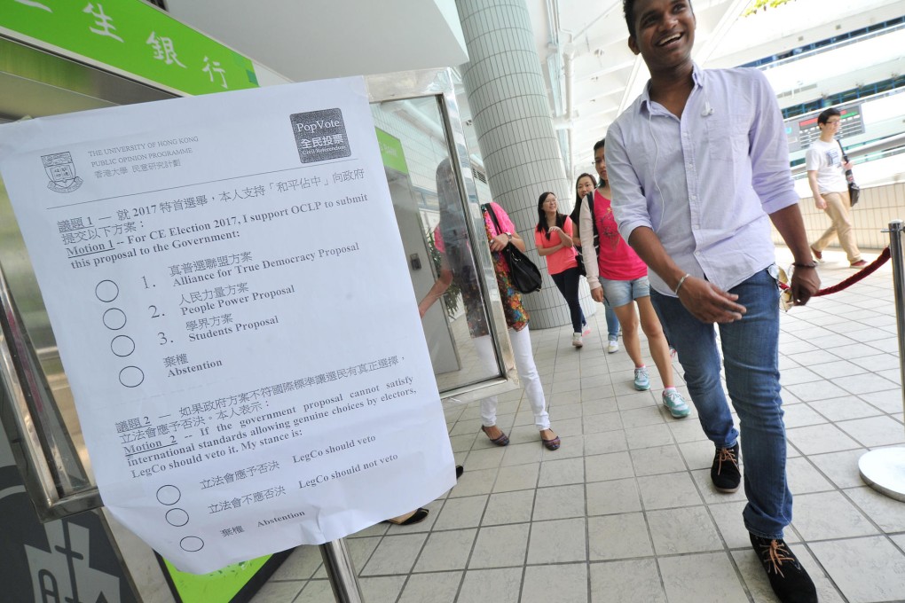 Student Karthi Duraisami heads to vote at the polling station at City University. Photo: Bruce Yan