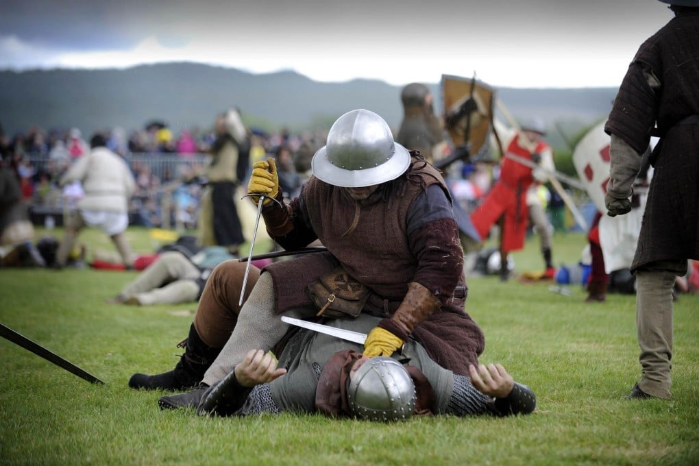 A re-enactment marks the 700th anniversary of the Battle Of Bannockburn. Photo: AFP
