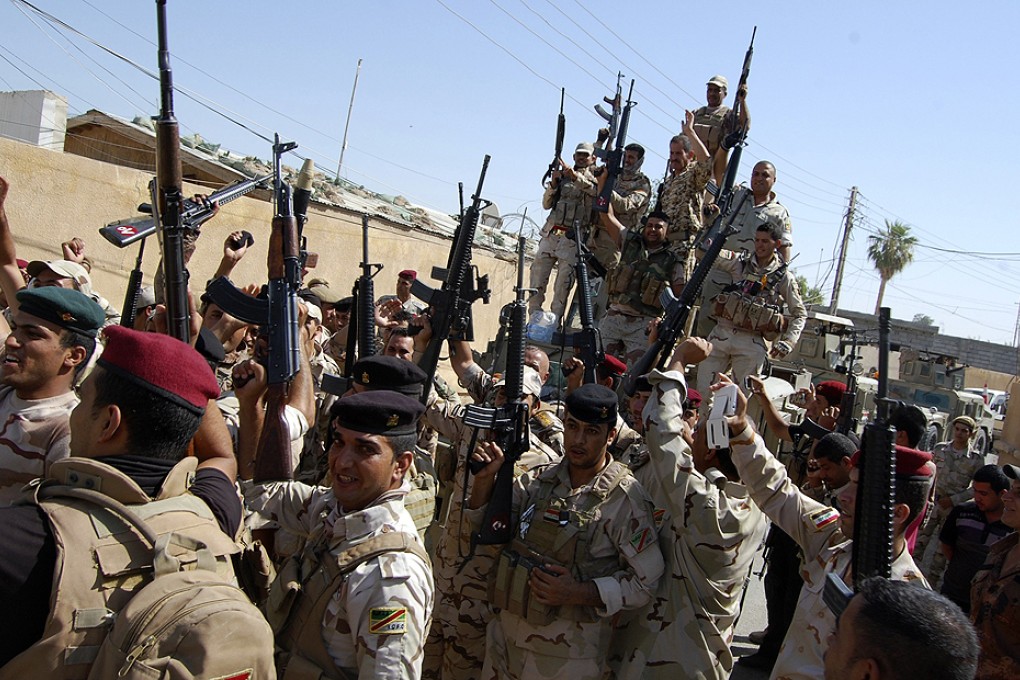Members of the Iraqi security forces fighting the ISIL on the outskirts of Samarra as they advance on Tikrit. Photo: Reuters