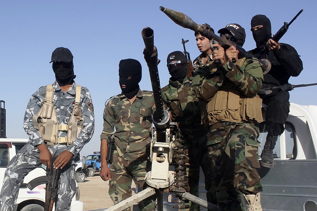Shiite volunteers, who have joined the Iraqi army to fight the ISIL, are engaged in an assault on Tikrit led by the Iraqi army. Photo: Reuters