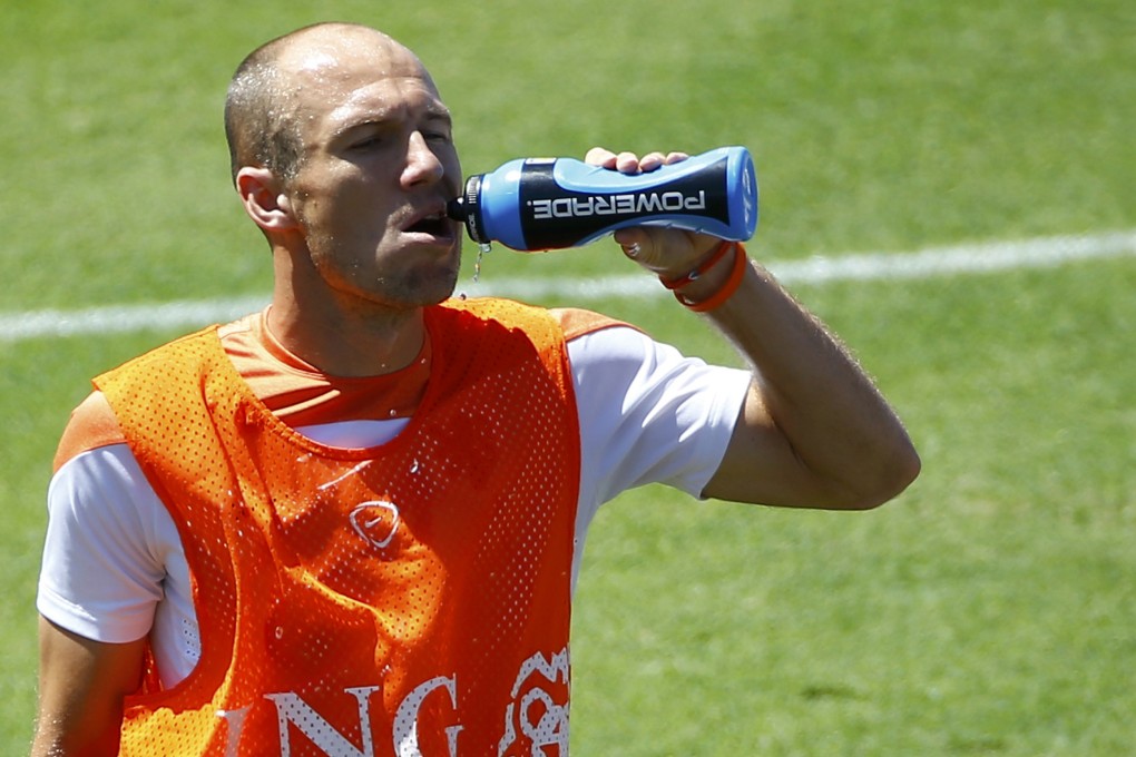 Arjen Robben gets some fluids during training. Photo: Reuters