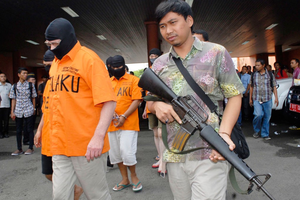 Indonesian agents arrested a Danish man (left) and a 17-year-old Hong Kong man (background) for drug trafficking. Photo: AFP