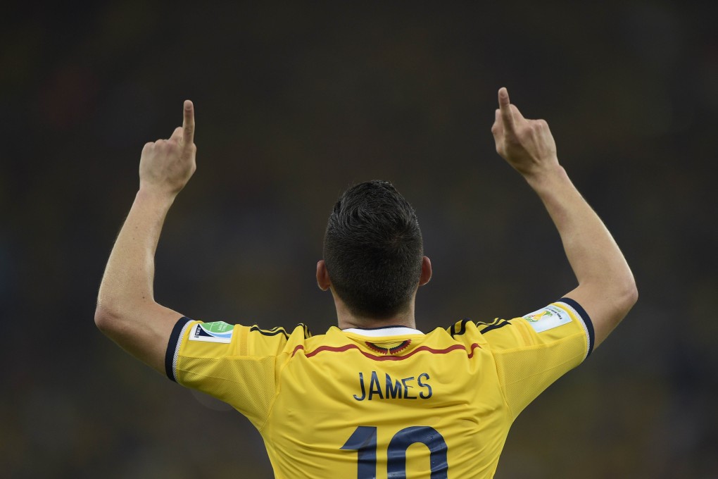 James Rodriguez points to the heavens after a godly strike. Photo: AFP