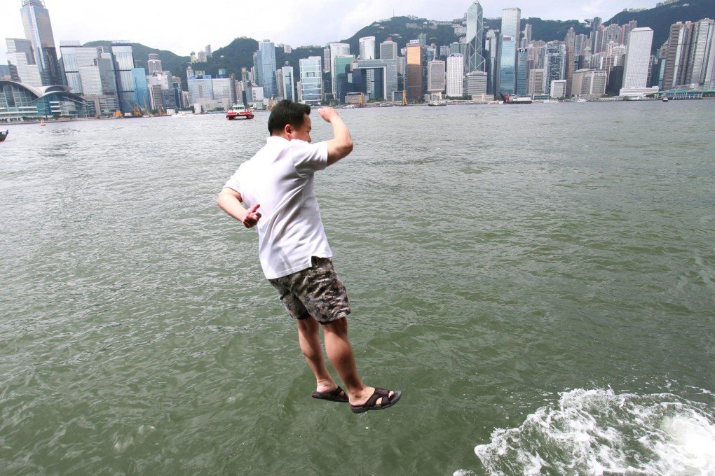 This man was one of four who jumped into the harbour off Tsim Sha Tsui to protest against plans for Occupy Central. Photo: Dickson Lee