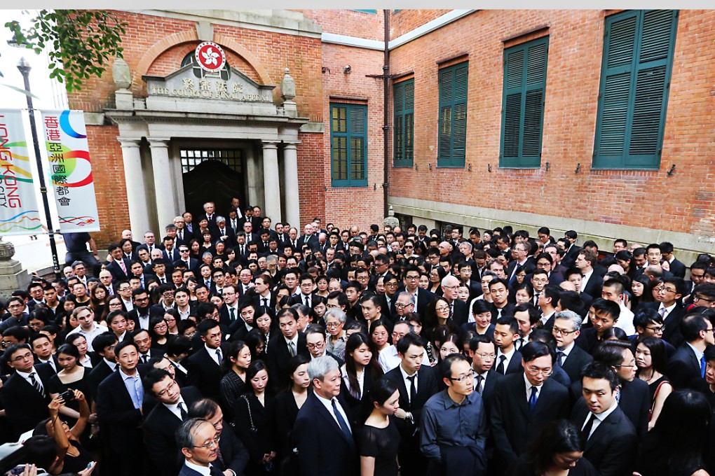 Hundreds of lawyers have marched silently on the streets of Central to protest against Beijing's recent White Paper. Photo: Felix Wong