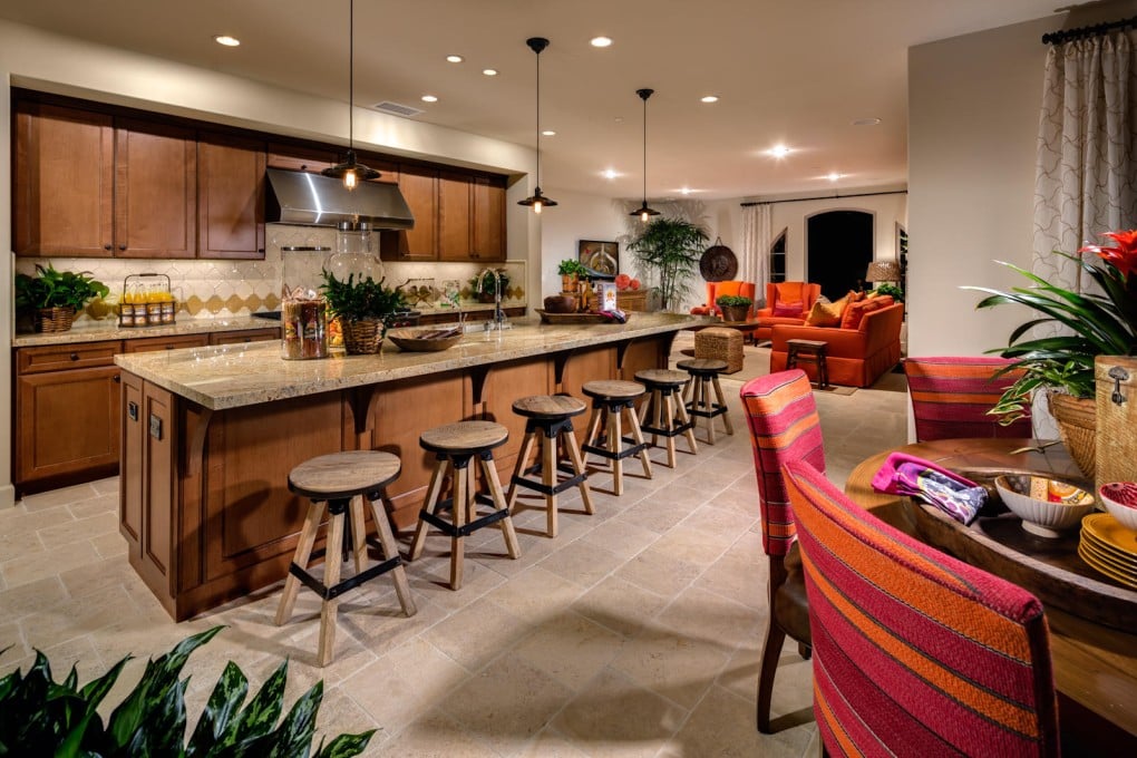 As kitchen islands become entertainment and work zones, home designers are experimenting with different layouts and materials to ensure a seamless surface. Photo: Robert Hidey Architects