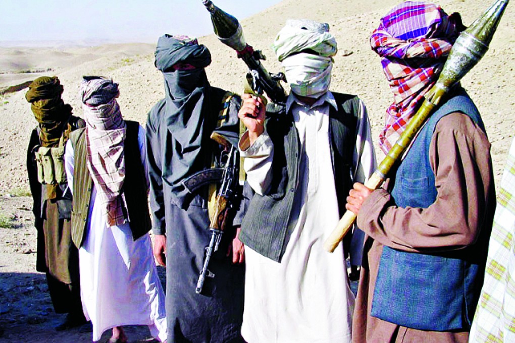 Militants in Afghanistan. The CIIRC, an internet watchdog, says some of the websites it verified as linked to terror activity were recruiting Chinese for training in overseas camps. Photo: AP