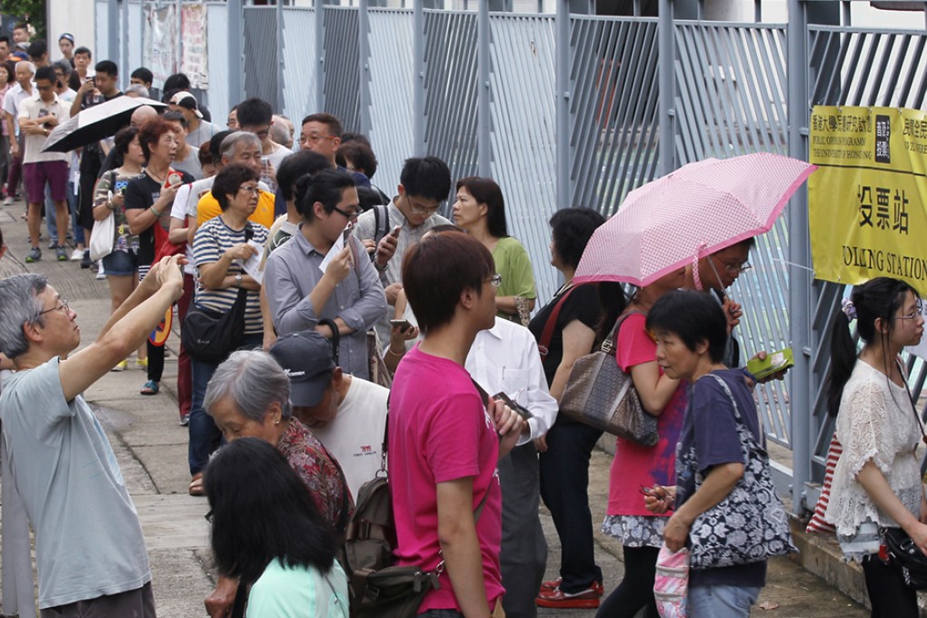 People cast vote in a polling station in Shatin during referendum on universal suffrage. Photo: Edward Wong