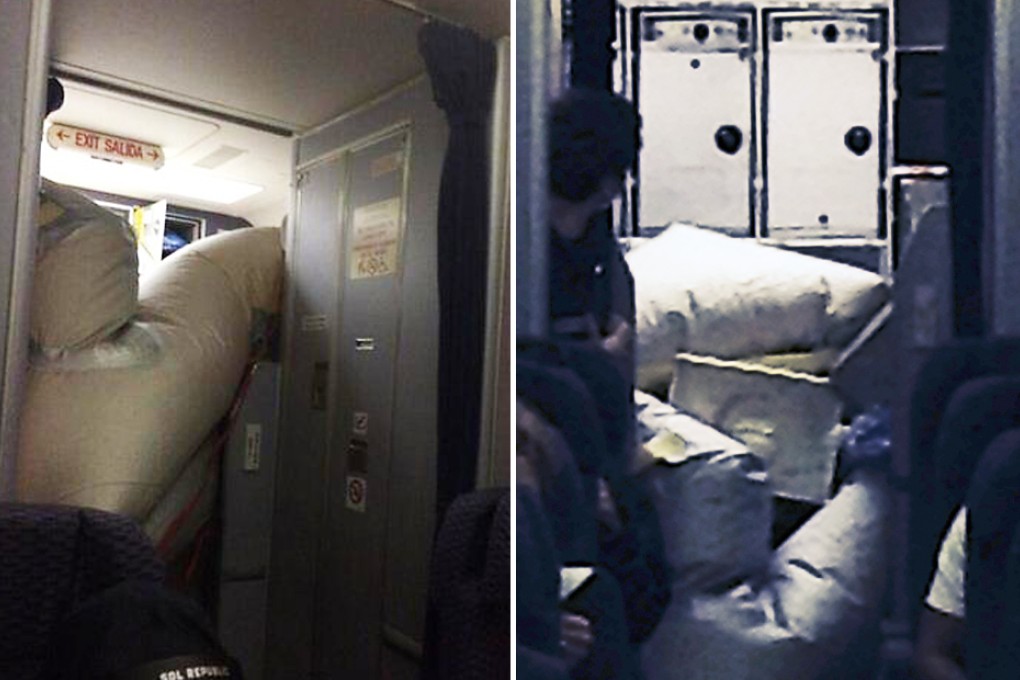 The inflated chute in the plane's cabin. Photos: SCMP, AP