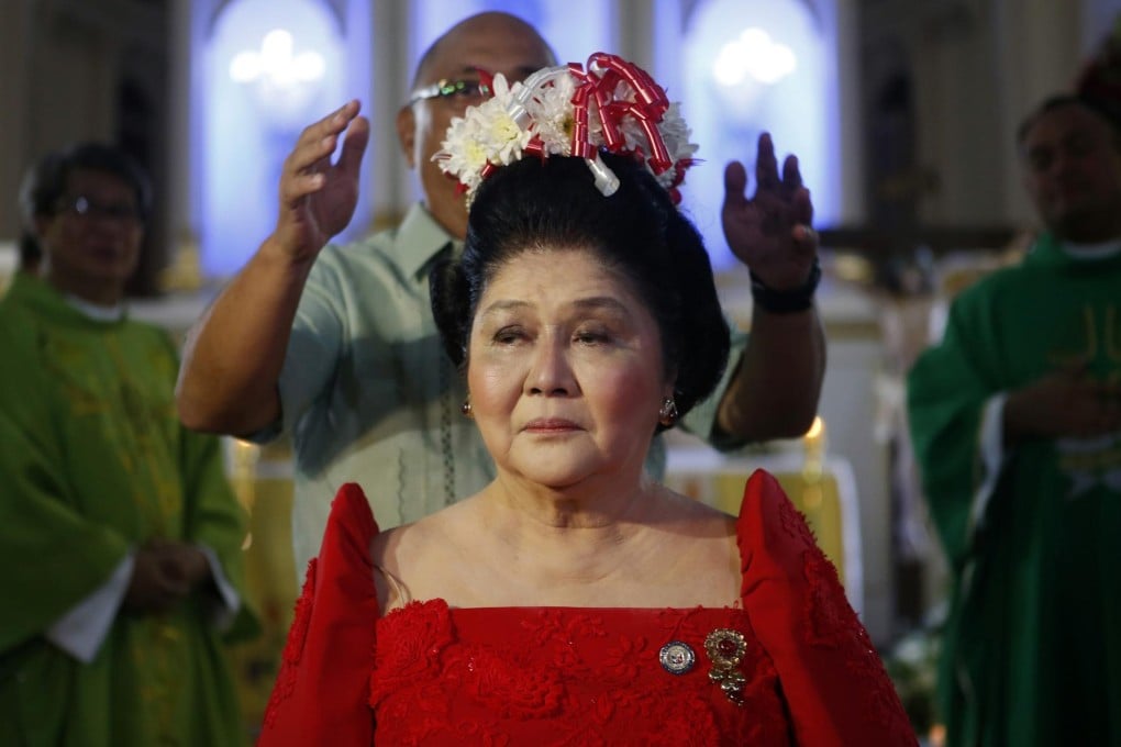 Imelda Marcos is crowned with flowers by a supporter as she celebrates her birthday in Batac in Ilocos Norte province. Photo: Reuters